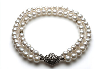 Obraz premium Elegant double strand pearl necklace with an intricate clasp lies against a white background showcasing luxury and style