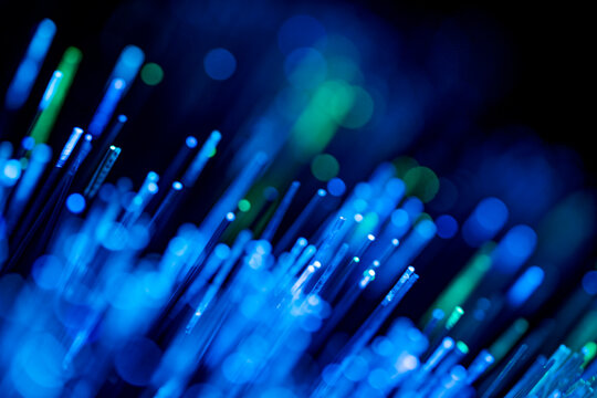 Abstract pattern of blue and green fiber optic lights