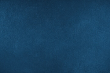 Abstract grungy texture background with different shades of dark matte blue color. Painted canvas, concrete surface, studio backdrop, grainy textured effect