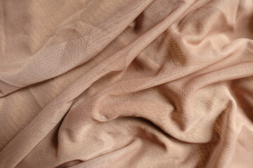 Fototapeta premium pastel beige unprinted polyester mesh fabric in soft folds