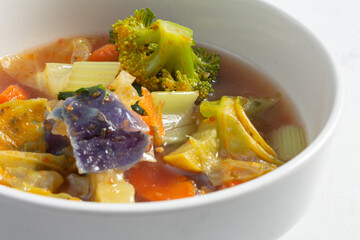 A closeup view of a bowl of minestrone.