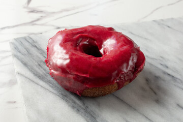 A view of a boysenberry donut.