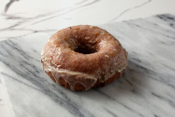 A view of a glazed gluten-free, dairy-free donut.