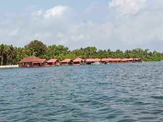 Floating cottages of a luxury resort on the serene backwaters of Alleppey (Alappuzha), Kerala, India.