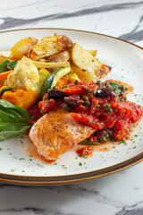 A view of a grilled salmon filet entree.