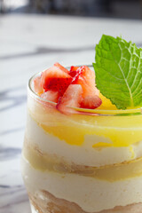 A closeup view of a lemon delight dessert in a glass.