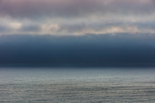 Lifting clouds and fog over the Pacific Ocean, dusk, Oswald West State Park, Oregon