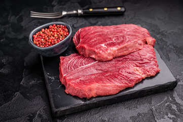 Raw Roe Deer steak, fresh Wild Venison Game Meat. black background. top view