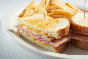 A closeup view of a grilled ham and cheese sandwich.