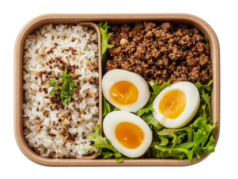 Healthy bento box lunch with rice ground meat boiled eggs and greens isolated on transparent background