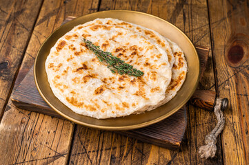 Potato Stuffed Flat Bread Aloo paratha, Traditional Indian food. wooden background. top view