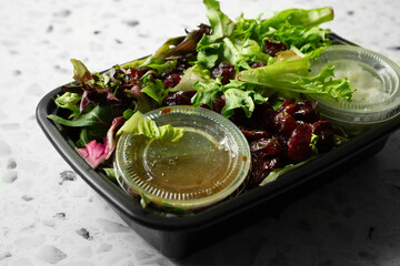 A view of a mixed green salad as a meal prep entree.