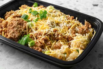 A closeup view of a taco rice bowl as a meal prep entree.