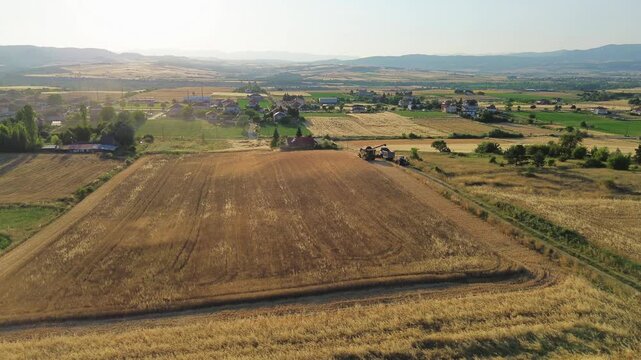 Golden hay field ready for harvest agriculture rural aerial drone landscape Greec