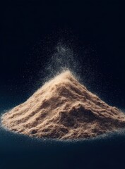 Light tan powder mound erupts