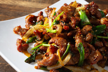 A closeup view of a plate of cumin lamb.