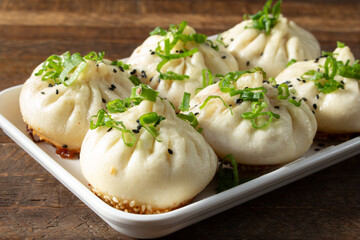 A view of pork pan fried buns.