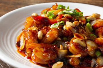 A closeup view of a plate of kung pao shrimp.