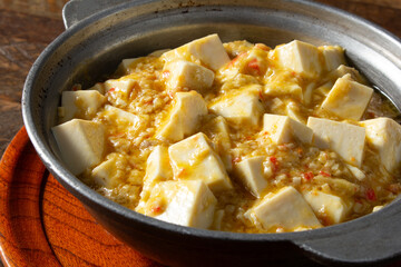 A view of a bowl of crab meat tofu.