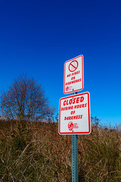 Caution and regulations signs in public park