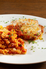 A view of a plate of chicken parmesan.