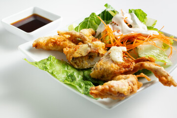 A view of a soft shell crab appetizer.