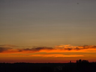 Sunrise through cloudy skies