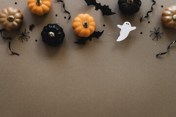 Halloween party decorations frame from pumpkins, bats top view. Happy halloween holiday greeting card flat lay style.