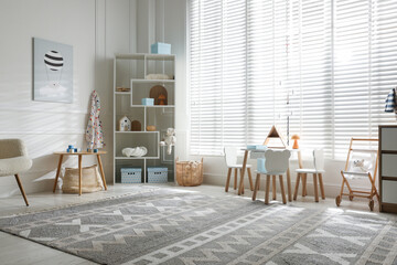 Stylish playroom with decor and furniture. Interior design