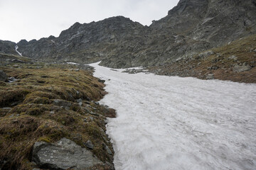 Mountain trekking, gaining heights, high-mountain landscape.
