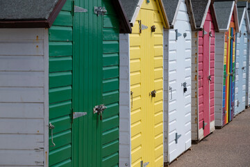 Line of colourful beach huts at English seaside