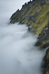 Obraz premium Mountain peaks above the clouds. Landscape of the High Tatras. 