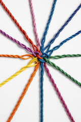 Bright multicolored ropes tied together in a knot, representing unity, teamwork, and strong connection
