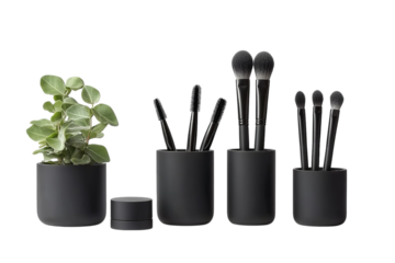 A set of matte black makeup brush cups and containers, arranged in an elegant display on a white isolated on a transparent background in PNG format.