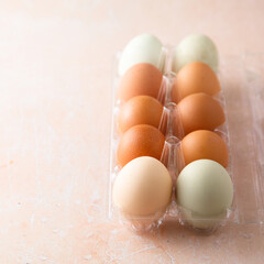 Organic multicolored eggs in a container