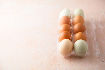 Organic multicolored eggs in a container