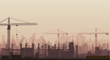 Obraz premium Construction site silhouette with cranes and buildings at sunset