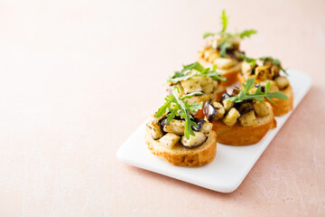 Crostini with eggplant and arugula