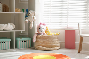 Stylish playroom with toys and furniture. Interior design