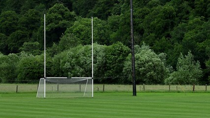 Rugby and gaelic football pitch with tall goalposts in Ireland.
