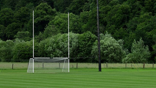 Rugby and gaelic football pitch with tall goalposts in Ireland.