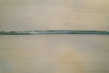 Cultivation Lines of Poland – Plowed Field with Green Belt in Agricultural Symmetry