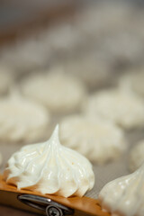Close-up of single handmade eco meringue on tray