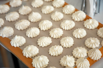 Close view of piped meringue in sustainable kitchen