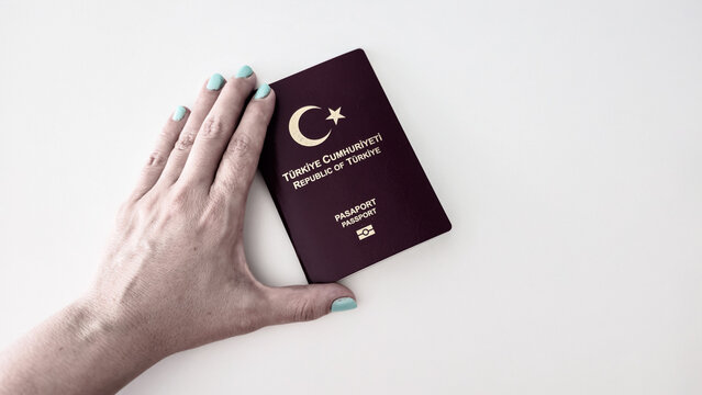 Photo series of Republic of Turkey passports in Turkish text"T&uuml;rkiye Cumhuriyeti Pasaport" on the white background and Turkey`s road map in Turkish language 


