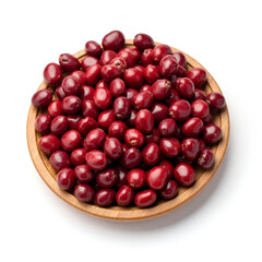 Close-up of dried red kidney beans scattered on a white background.