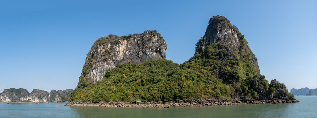 A panoramic shot of a forested island in Halong Bay