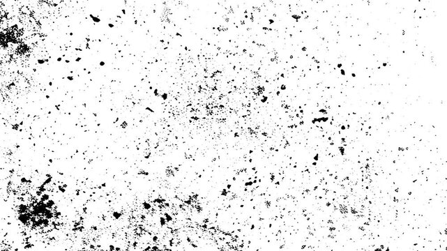 White surface scattered with many small black specks, ideal for backgrounds, textures, design elements, or abstract concepts in creative projects.