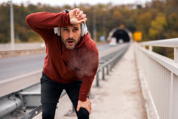 Man Taking a Break After Outdoor Running Exercise