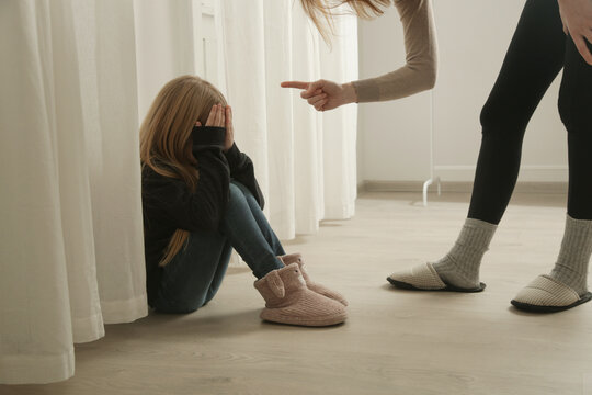 The bullying parent. Angry mother threatening and yelling to child. Harmful parenting method.	